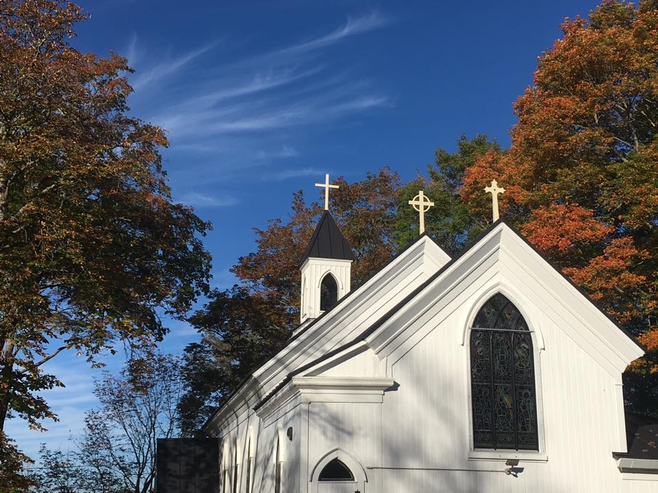Image of St John's Church with autumn trees